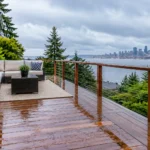 Rainy deck with city skyline view